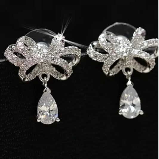 Celebration Earrings Big Bow And Pear Cut Crystal In Silver Polish Vista Shops
